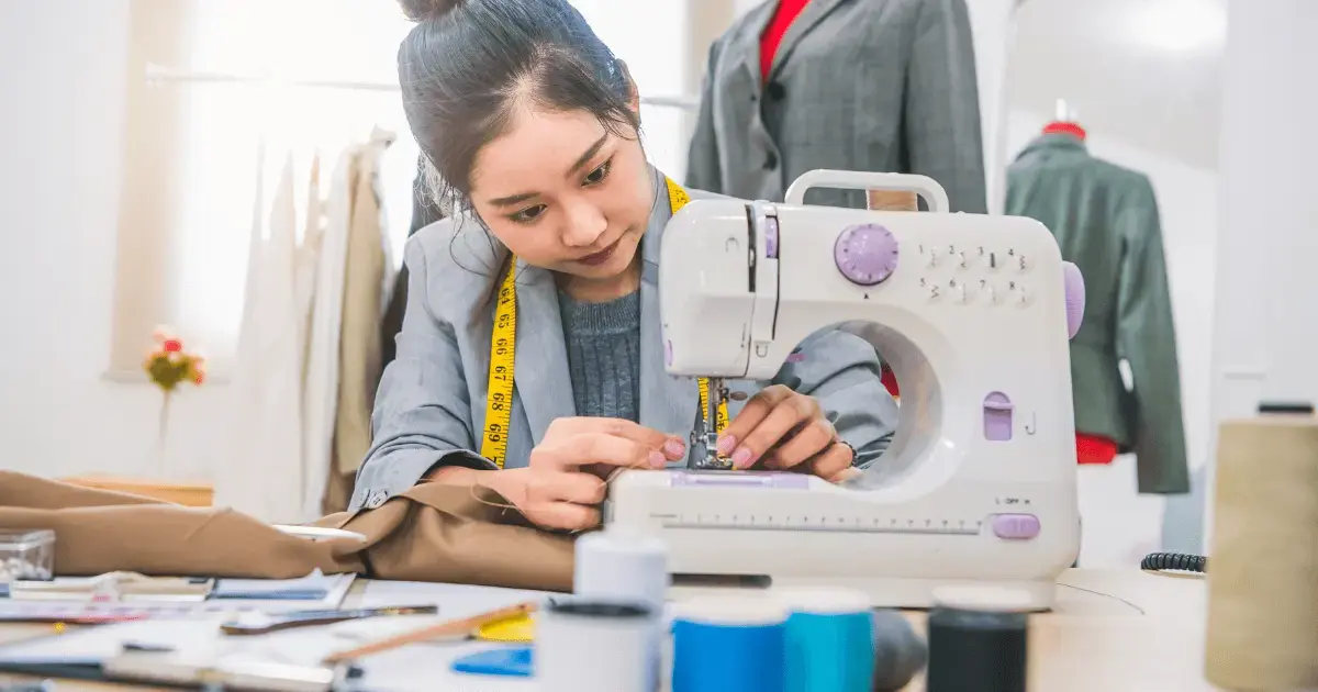 Woman using a sewing machine. 