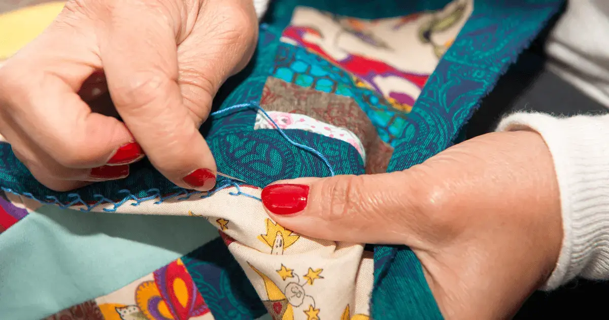 A woman hand quilting