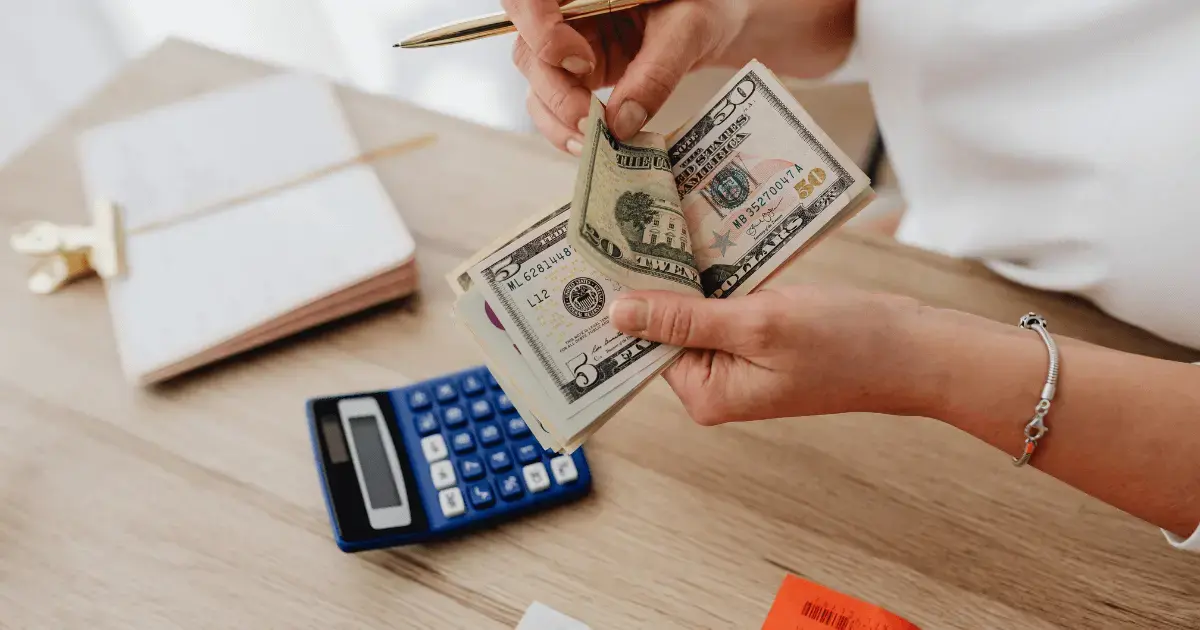 a person counting money 