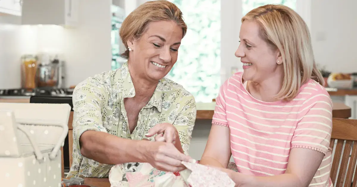 two women quilting together