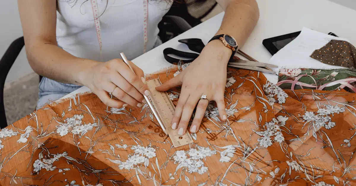 Woman measuring fabric