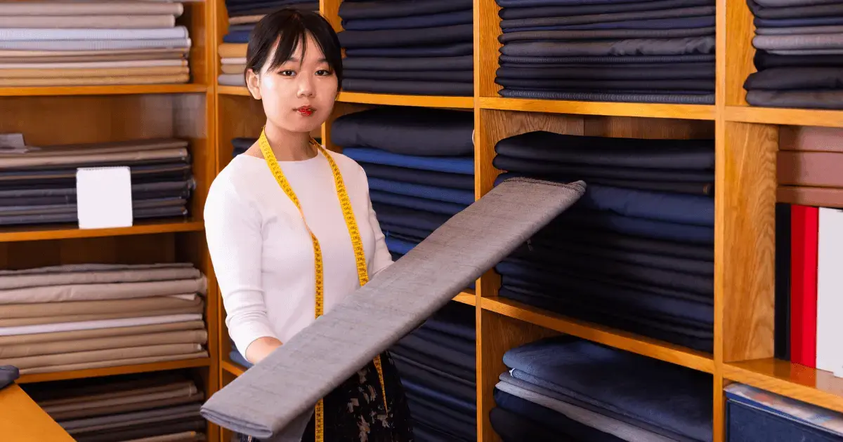 Woman working in fabric store
